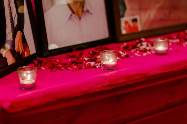 Selection of decorative candle holders atop a vibrant red tablecloth, offering a warm atmosphere