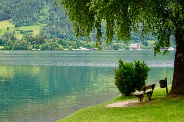A city on the shore of Lake Zell. Zell am See in summer. An Austrian town on the shore of a lake in summer. zell am see es la capital administrativa del distrito de zell am see en el estado austriaco de salzburgo. situado en los alpes de kitzbühel, la ciudad es un importante destino turístico debido a sus estaciones de esquí y la costa en el lago zell.e