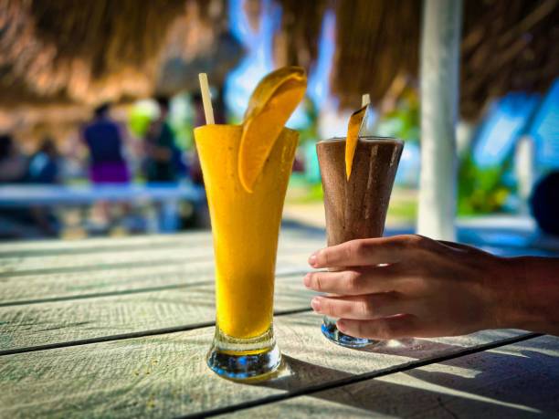 istock Person holding a drink with an orange slice on it. 1479369503