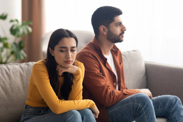 istock Unhappy Arabic Couple Sitting On Couch Indoor, Having Relationship Problems 1479370186