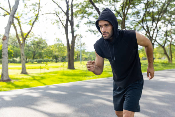 istock Caucasian man stretching body and warm up exercise at public park. 1479370663