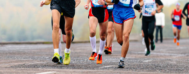 istock group runners athletes running marathon along river embankment, front view legs jogger run sports race 1479373067