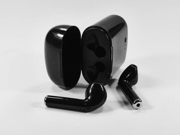 istock Closeup of black wireless earbuds with a case, on a white background 1479374778