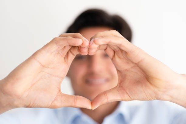 istock young entrepreneur making heart shape with his hand 1479375783