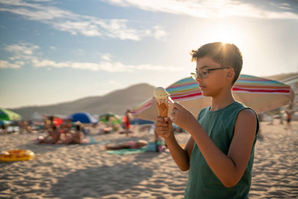 istock Boy eating ice cream on the beach 1479380801
