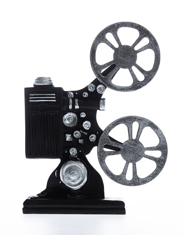 Old film projector on white background