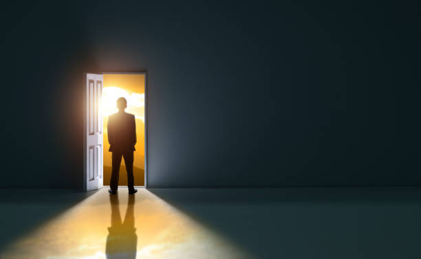 istock Businessman standing in front of open door 1479381054