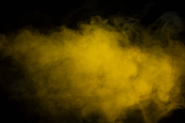 istock Yellow steam on a black background. 1479381255