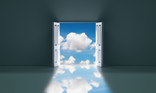 Open door with cloud sky