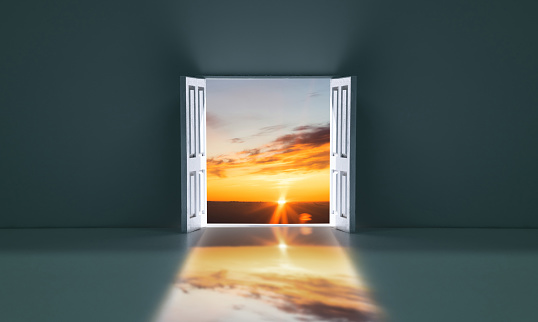 Open door with sunset sky