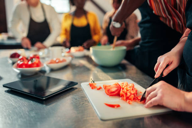 istock Close up of hands cutting vegetables. 1479384241