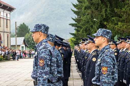 Targu Ocna, Romania – August 31, 2022: A group of police officers wearing new blue uniforms standing in formation in a ceremonial setting