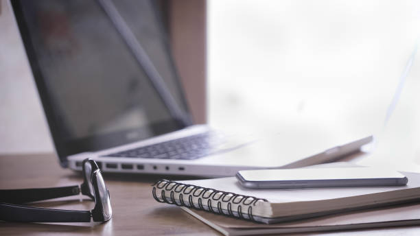 istock Working desk with a laptop, notebooks, and a mobile ph 1479391393