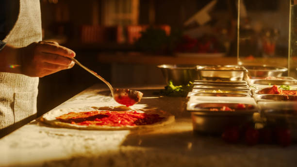 istock In Restaurant Professional Chef Preparing Pizza, Adding Ingredients, Cheese, Special Sauce, Traditional Family Recipe. Authentic Sunny Pizzeria with Deliciously Organic Food. Cinematic Shot 1479395036