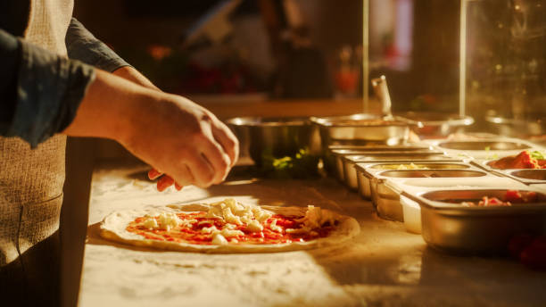 istock In Restaurant Professional Chef Preparing Pizza, Adding Ingredients, Olive Oil, Special Sauce, Traditional Family Recipe. Authentic Sunny Pizzeria with Deliciously Organic Food. Cinematic Shot 1479395080