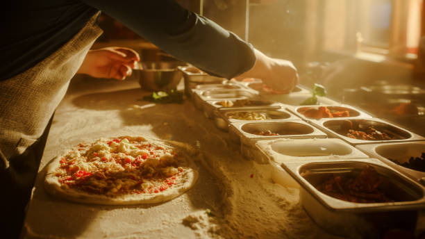 istock In Restaurant Professional Chef Preparing Pizza, Kneading Dough, Adding Ingredients, Cheese, Vegetables, Traditional Family Recipe. Authentic Pizzeria with Delicious Organic Food. Focus on Hands 1479395635