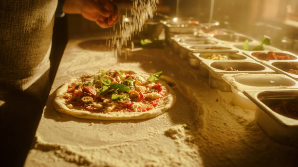 istock In Restaurant Professional Chef Preparing Pizza, Kneading Dough, Adding Ingredients, Special Sauce, Traditional Family Recipe. Authentic Italian Pizzeria with Delicious Organic Food. Focus on Hands 1479395688