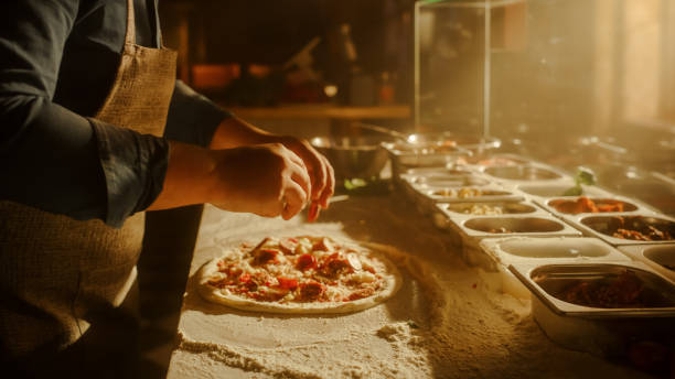 istock In Restaurant Professional Chef Preparing Pizza, Kneading Dough, Adding Ingredients, Special Sauce, Traditional Family Recipe. Authentic Italian Pizzeria with Delicious Organic Food. Focus on Hands 1479395849
