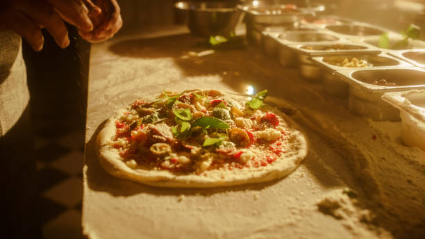 istock In Restaurant Professional Chef Preparing Pizza, Kneading Dough, Adding Ingredients, Special Sauce, Traditional Family Recipe. Authentic Italian Pizzeria with Delicious Organic Food. Focus on Hands 1479396229