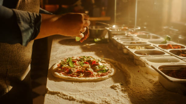 istock In Restaurant Professional Chef Preparing Pizza, Kneading Dough, Adding Ingredients, Special Sauce, Traditional Family Recipe. Authentic Italian Pizzeria with Delicious Organic Food. Focus on Hands 1479396243