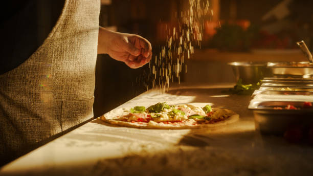 istock In Restaurant Professional Chef Preparing Pizza, Kneading Dough, Spinning and Tossing it, Traditional Family Recipe. Authentic Pizzeria with Deliciously Organic Food. Cinematic Sunny Shot 1479397393