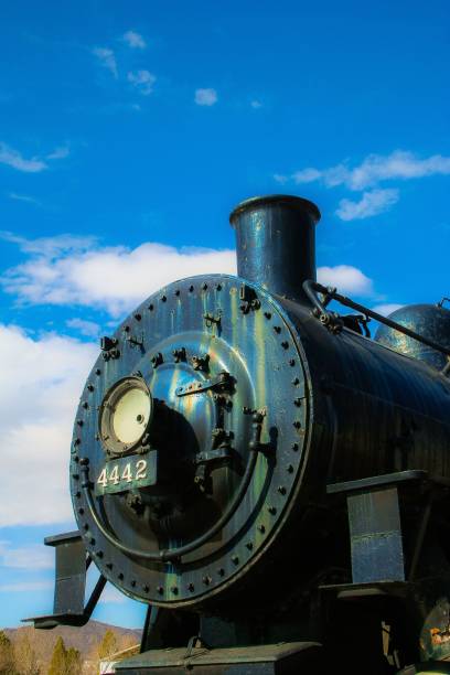 istock Vertical shot of an antique train under a blue sky 1479397806