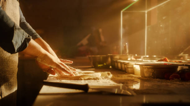 istock In Restaurant Professional Chef Preparing Pizza, Tenderly Working, Kneading Dough, Adding Ingredients, Special Sauce, Traditional Family Recipe. Authentic Pizzeria with Deliciously Tasty Organic Food 1479398785