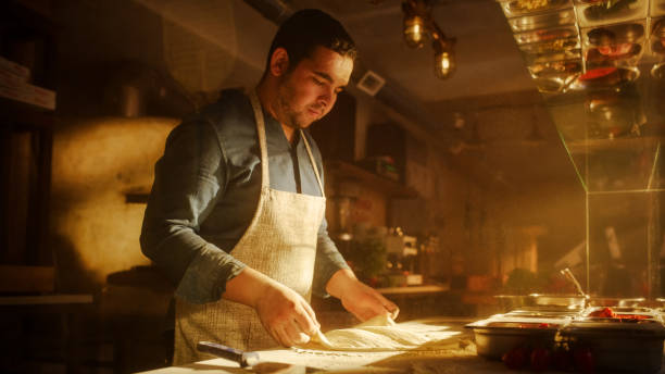 istock In Restaurant Professional Chef Preparing Pizza, Using Flour, Kneading Dough, Traditional Family Recipe. Authentic Pizzeria, Cooking Delicious Organic Food. Cinematic Focus on Hands Shot 1479398810