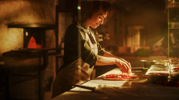 istock In Restaurant Professional Female Chef Preparing Pizza, Adding Ingredients, Special Sauce, Cheese, Traditional Family Recipe. Authentic Italian Pizzeria, Cooking Organic Food 1479399078