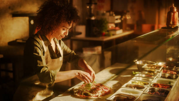 istock In Restaurant Professional Female Chef Preparing Pizza, Adding Ingredients, Special Sauce, Cheese, Traditional Family Recipe. Authentic Sunny Pizzeria with Delicious Organic Food 1479399298