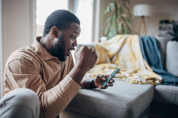 Man having fun gambling on phone