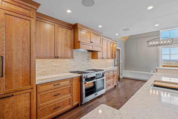 istock Contemporary kitchen features dark wood cabinets, sleek granite countertops 1479399629