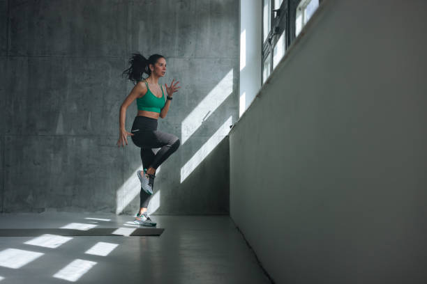 istock Determined athletic woman exercising. 1479399773