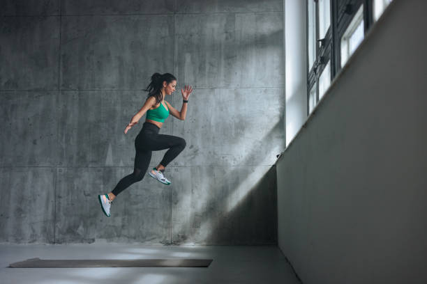 istock Fit young woman jumping. 1479399873