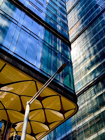 This high-rise building features an abundance of windows along its sides, providing a stunning view of the surrounding area