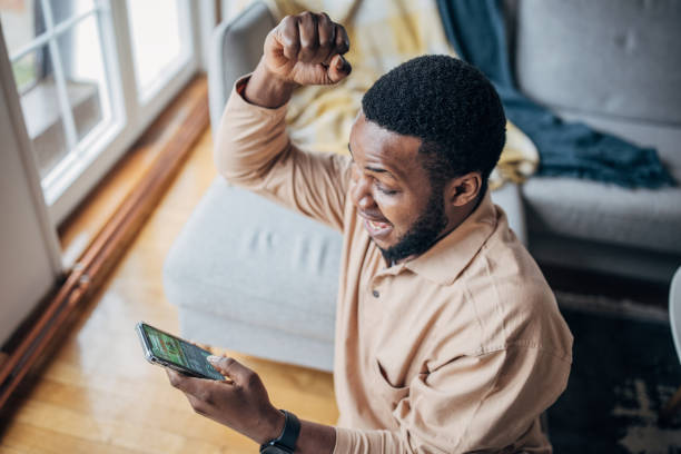 istock Man checking the score on phone 1479401070