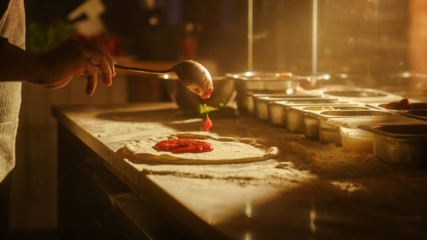istock In Restaurant Professional Chef Preparing Pizza, Kneading Dough, Adding Ingredients, Cheese, Vegetables, Traditional Family Recipe. Authentic Pizzeria with Delicious Organic Food. Focus on Hands 1479403566