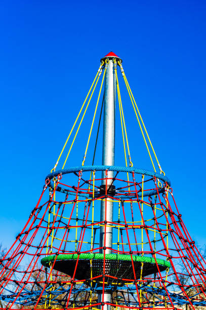 A vertical shot of the climbing net playground under a clear sky