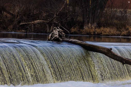 A log stuck in a dam located on the Fox River in South Elgin, Illinois