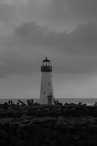 A vertical greyscale of the Walton Lighthouse on a rainy day, California, US