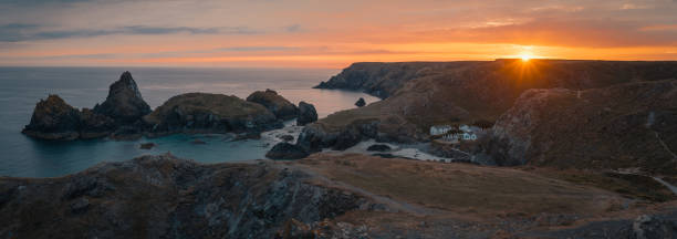 istock Panoramic shot of cliffs surrounded by the sea during a beautiful sunset in the evening 1479411720