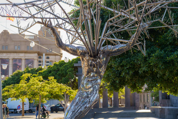 Santa Cruz de Tenerife, Canary Islands, Spain - December 17, 2022: The sculpture is located in the city's main square, Plaza de España (English: Spain Square). It was created by Julio Nieto and is made of stainless steel. It is five meters high.