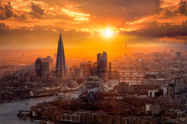 A beautiful sunset behind the London skyline with Tower Bridge and River Thames
