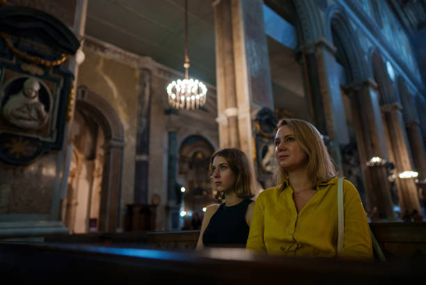 istock Family in a large Catholic cathedral. 1479418468
