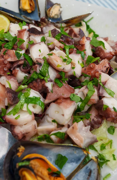 istock Traditional salad with octopus and herbs. 1479418710