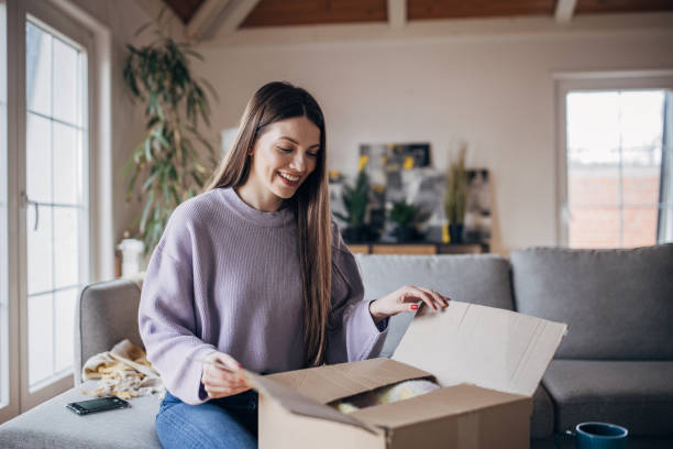 istock Woman opening a package 1479418797