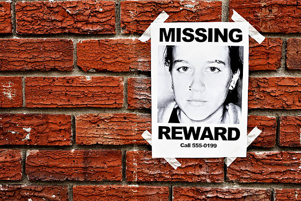 &quot;Missing&quot; poster of teenage girl taped to red brick wall A "Missing" poster of a teenage girl, offering a reward,  is taped to a red brick wall, possibly in a police station. The phone number is a "555" dummy following the Hollywood convention. Please see http://en.wikipedia.org/wiki/555_%28telephone_number%29 lost stock pictures, royalty-free photos & images