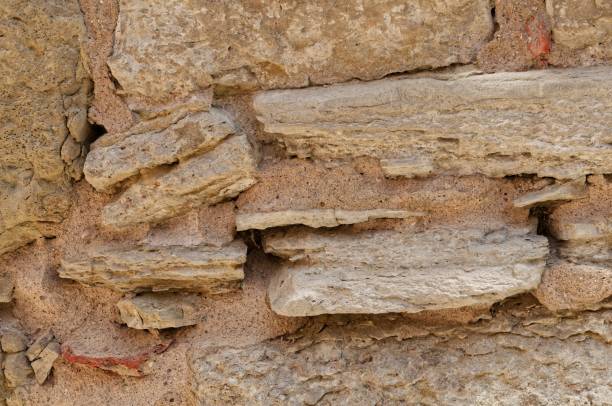 istock Old stone wall illuminated by natural light, weathered by time 1479424202