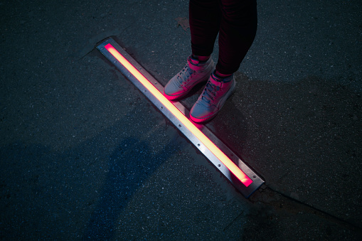 Integrated crosswalk stoplight for pedestrians in asphalt.