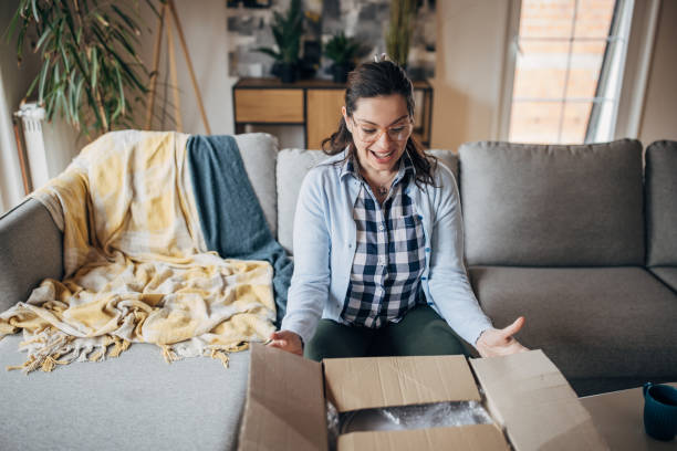istock Woman opening a package 1479426960